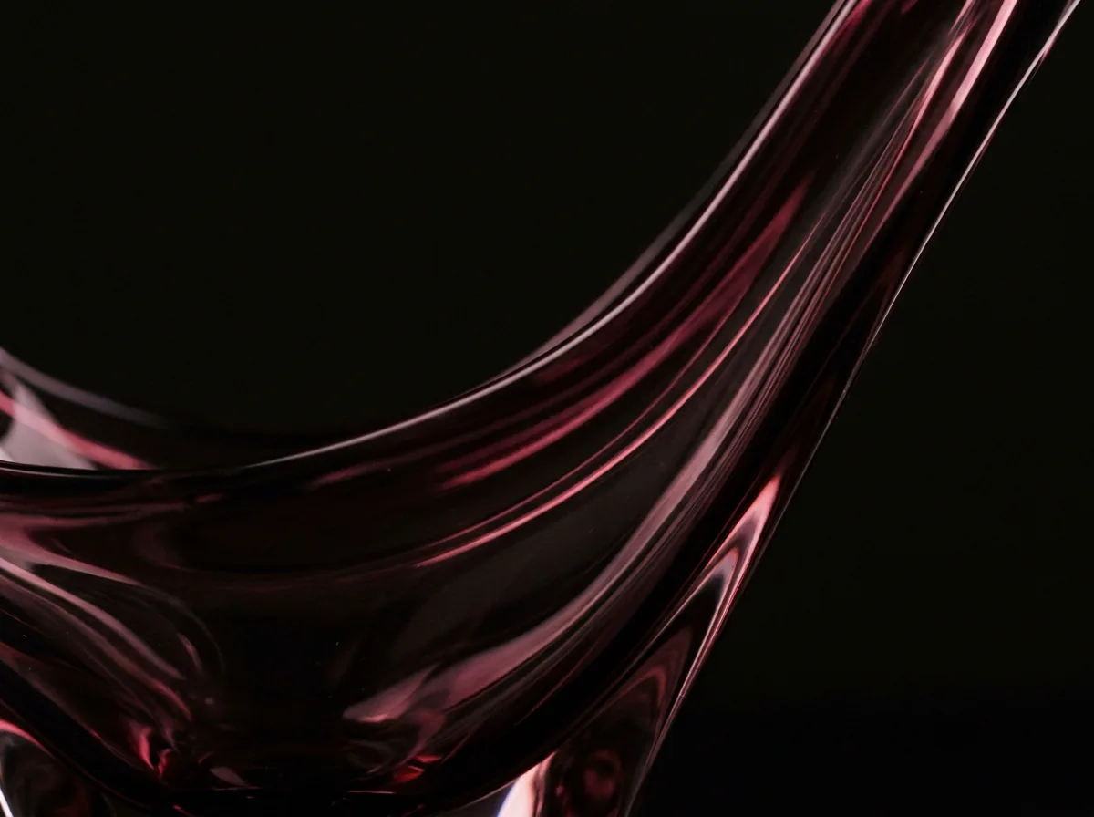 Abstract burgundy light through dark glass